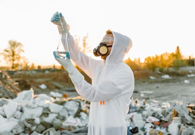 A researcher holding water samples